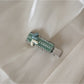 Beau chic flat hair clip resting on a textured fabric surface