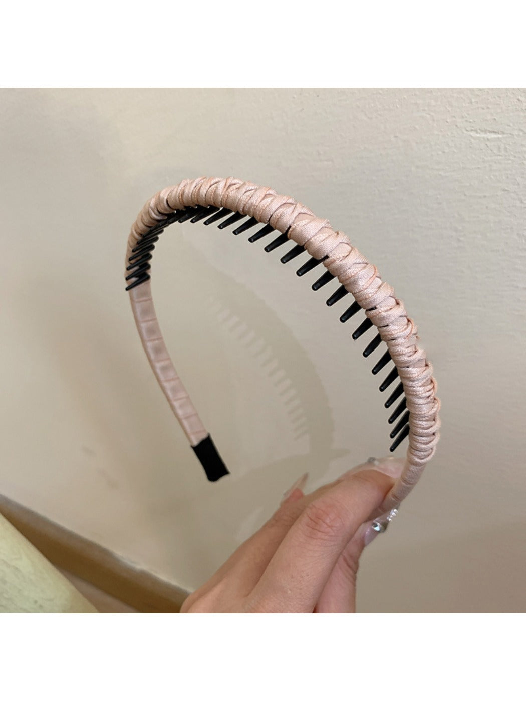 Gifty headband folded to display its flexibility and fabric quality