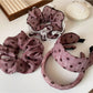 Close-up of black and white polka dot ruffled scrunchie fabric texture