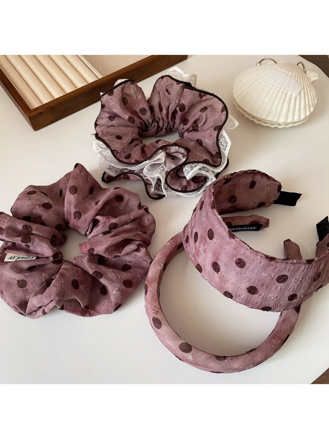 Close-up of black and white polka dot ruffled scrunchie fabric texture