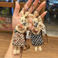 Fabric cartoon rabbit shaped keychain with pink ears and embroidered face