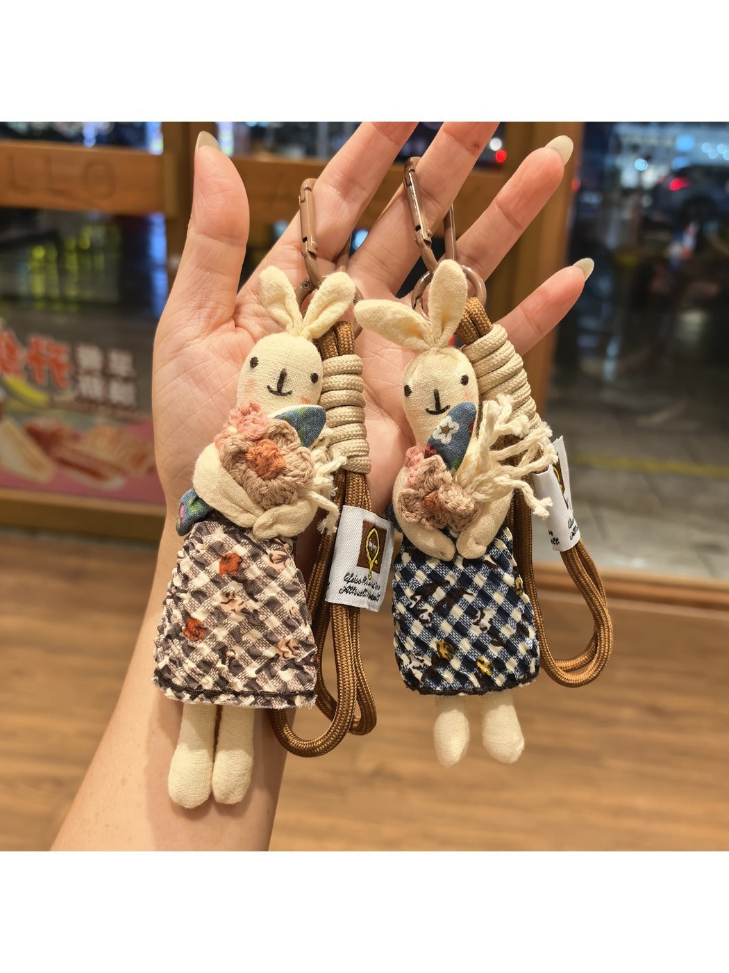 Fabric cartoon rabbit shaped keychain with pink ears and embroidered face