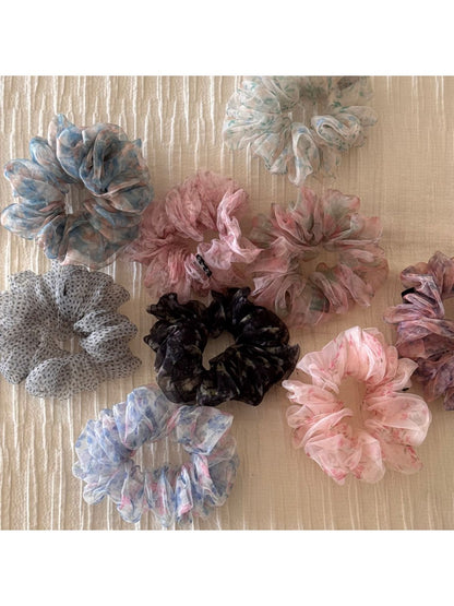 Close-up of vibrant floral pattern on scrunchie fabric