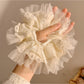 Close-up of Gifty bow scrunchie showing fabric texture and bow detail