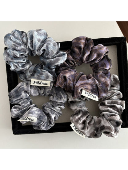 Model wearing Gifty Dreamy Silky Retro Scrunchie styled in a ponytail