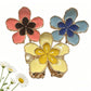 Beau rural style flower shaped hair clip with beige fabric petals and gold center