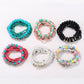 Lovra rhinestone pendant with colorful beaded bracelet on white background