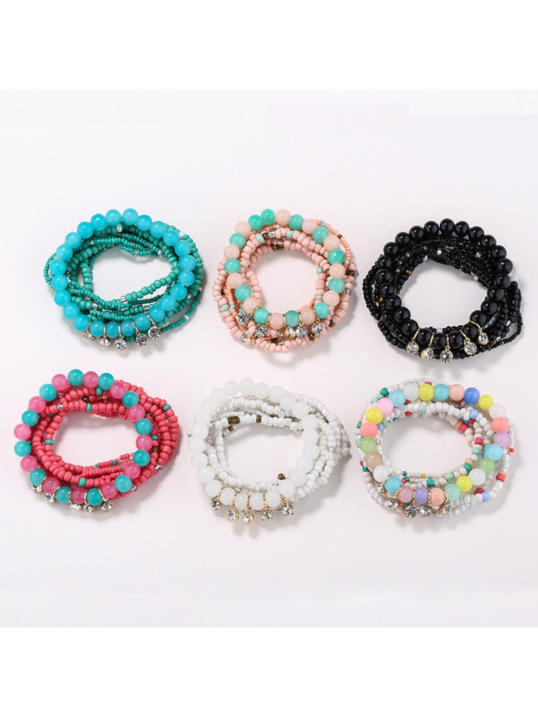Lovra rhinestone pendant with colorful beaded bracelet on white background