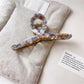 Beau vintage crisscross hair claw clip showing spring mechanism