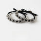 Close-up of Gifty minimalist modern beaded hair tie with small round beads on elastic band