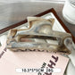 Beau marble pattern square claw clip positioned at an angle to show depth