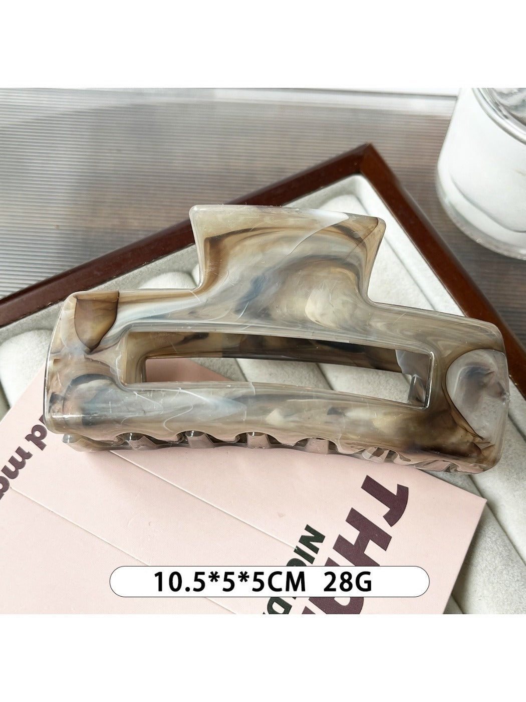 Beau marble pattern square claw clip positioned at an angle to show depth