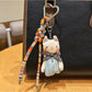 Classic cat charm keychain displayed on a wooden surface