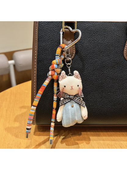 Classic cat charm keychain displayed on a wooden surface