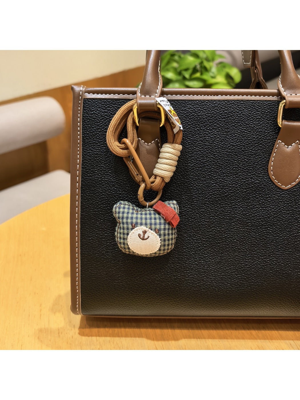 Bear charm keychain with a small bell attached to the keyring