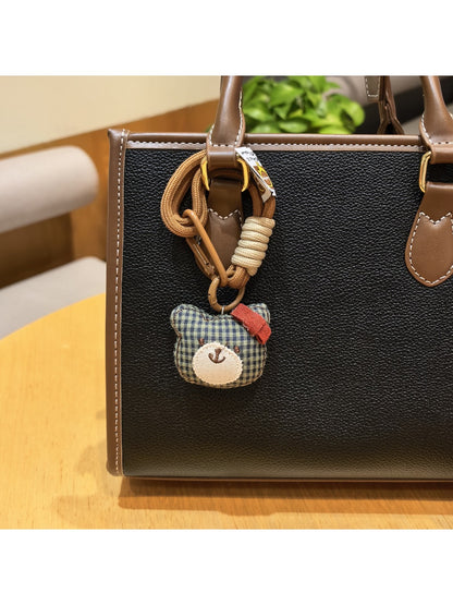 Bear charm keychain with a small bell attached to the keyring