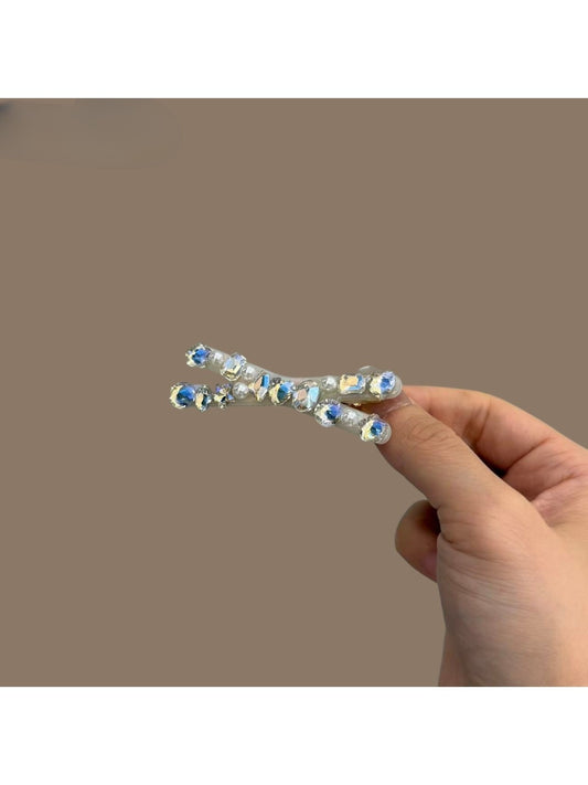 Beau sparkly crisscross bar hair clip on white background, showing front view