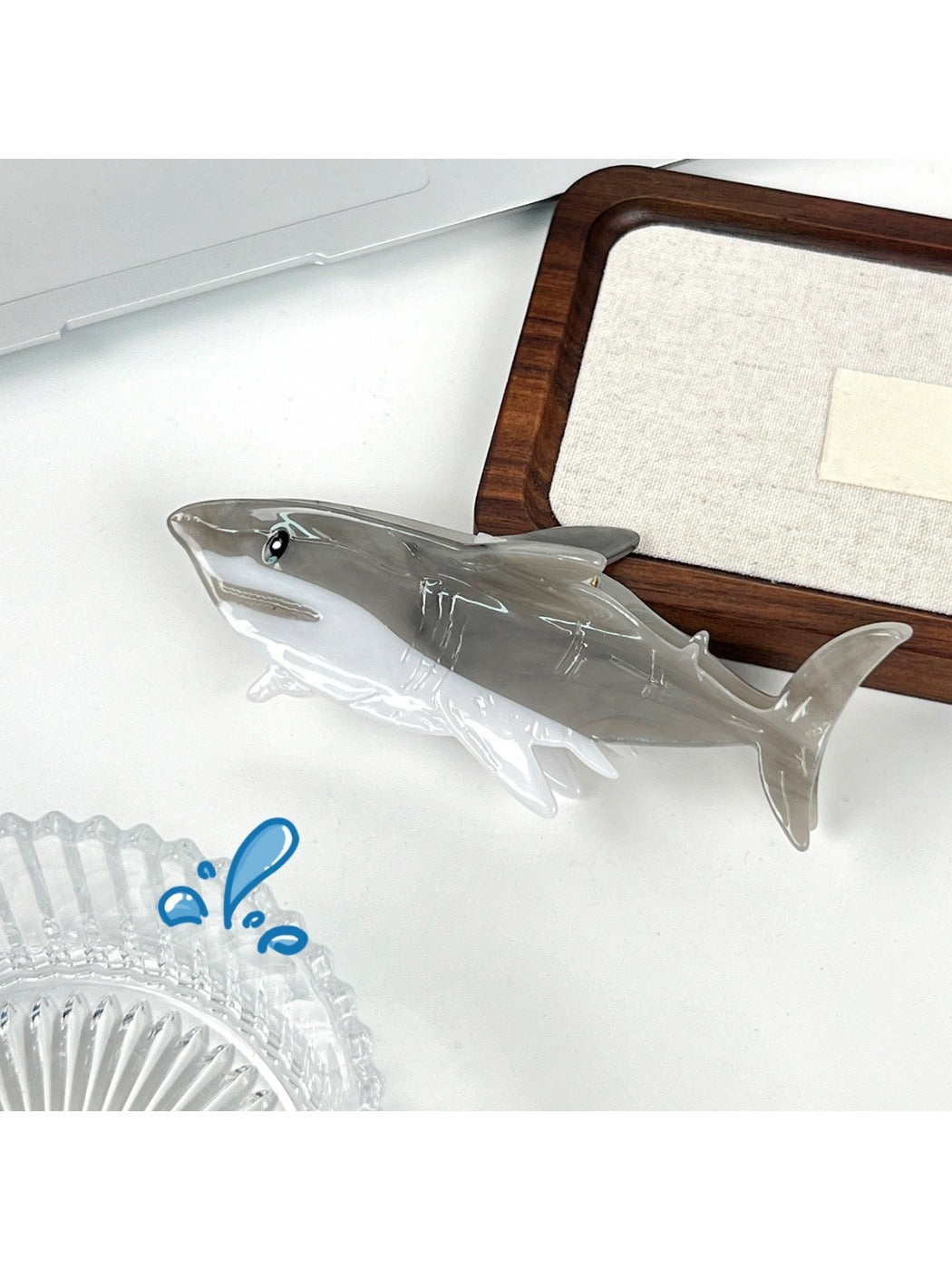 Beau shark shaped hair claw clip securing a ponytail on a model