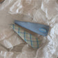 Beau oval hair clip with bright, mixed colors clipped into blonde hair