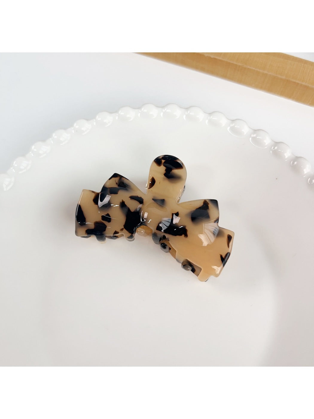 Beau hair claw clip shown from the back with clip hinge visible