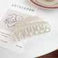 Top view of Beau double row wavy claw clip displaying smooth finish
