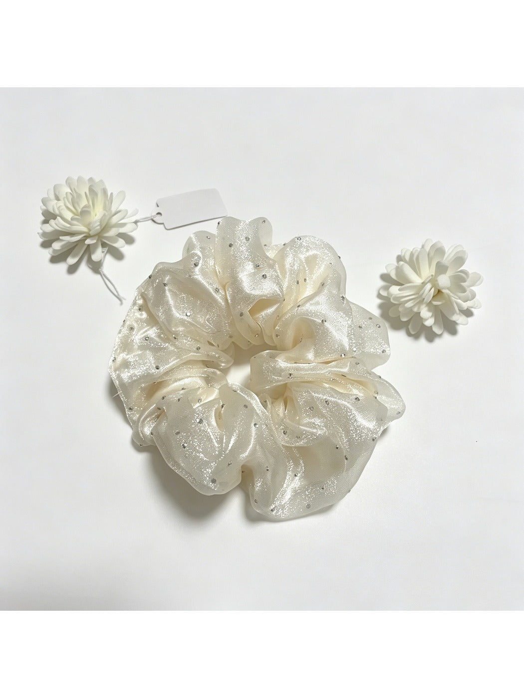 Gifty tulle scrunchie with sparkling rhinestones styled in a ponytail