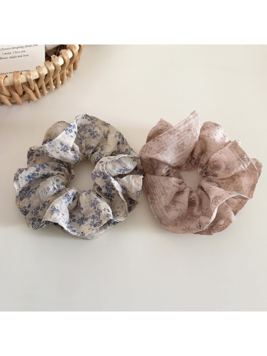 Side view of Gifty vintage floral print scrunchie highlighting ruffled texture