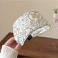 Side view of countryside style headband worn on a model with loose hair