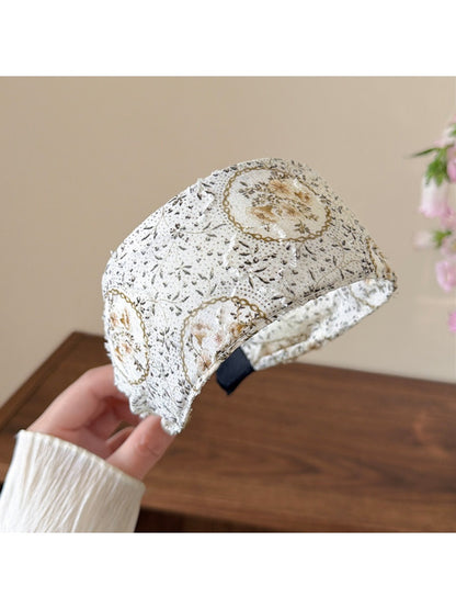 Side view of countryside style headband worn on a model with loose hair