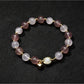 Lovra beaded bracelet with heart pendant in natural light