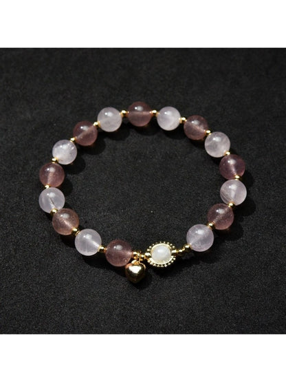 Lovra beaded bracelet with heart pendant in natural light