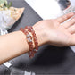 Side view of Lovra pink crystal beaded bracelet showing bead texture and shine