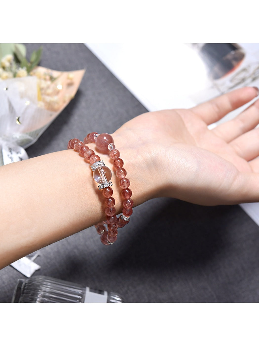 Side view of Lovra pink crystal beaded bracelet showing bead texture and shine