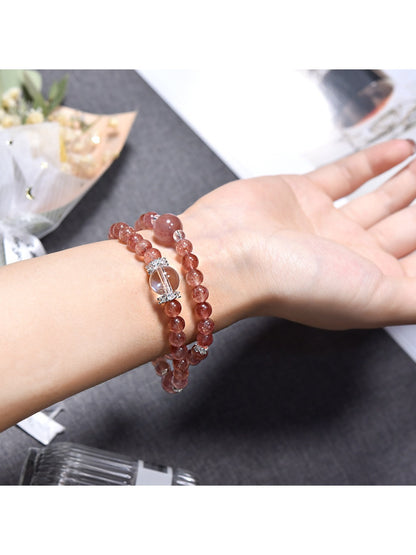 Side view of Lovra pink crystal beaded bracelet showing bead texture and shine
