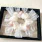 Gifty floral scrunchie styled on a wrist as a bracelet with soft fabric folds