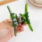 Beau hair claw clip open, displaying spring mechanism and bow accent