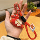 Keypus pony charm keychain with metal keyring and clasp on a colorful surface
