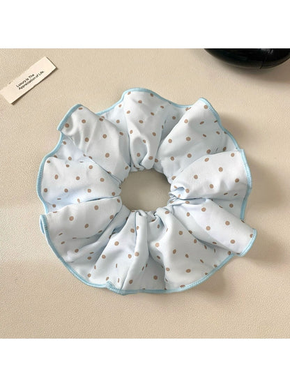Gifty scrunchie packaged in a clear plastic bag with branding label