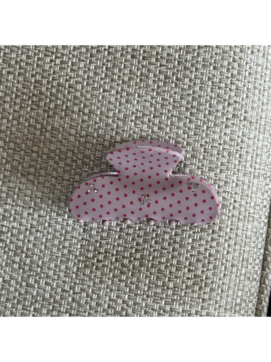 Beau pink polka dot claw clip shown from above emphasizing the polka dot pattern