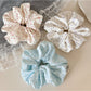Close-up of Gifty chic tiny floral print scrunchie on a white background
