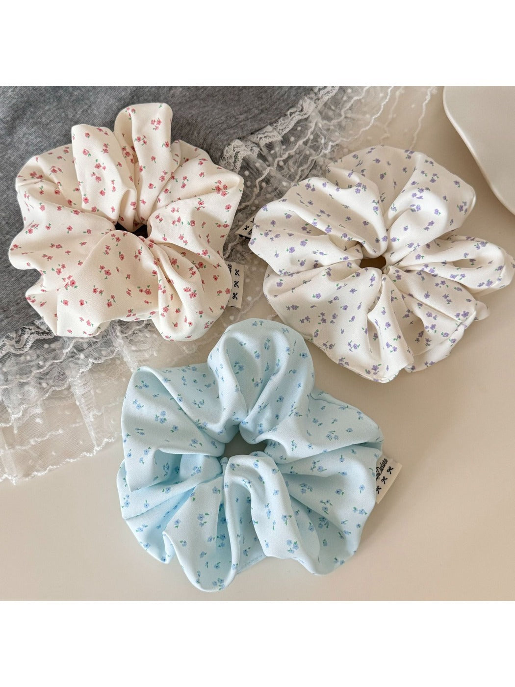 Close-up of Gifty chic tiny floral print scrunchie on a white background