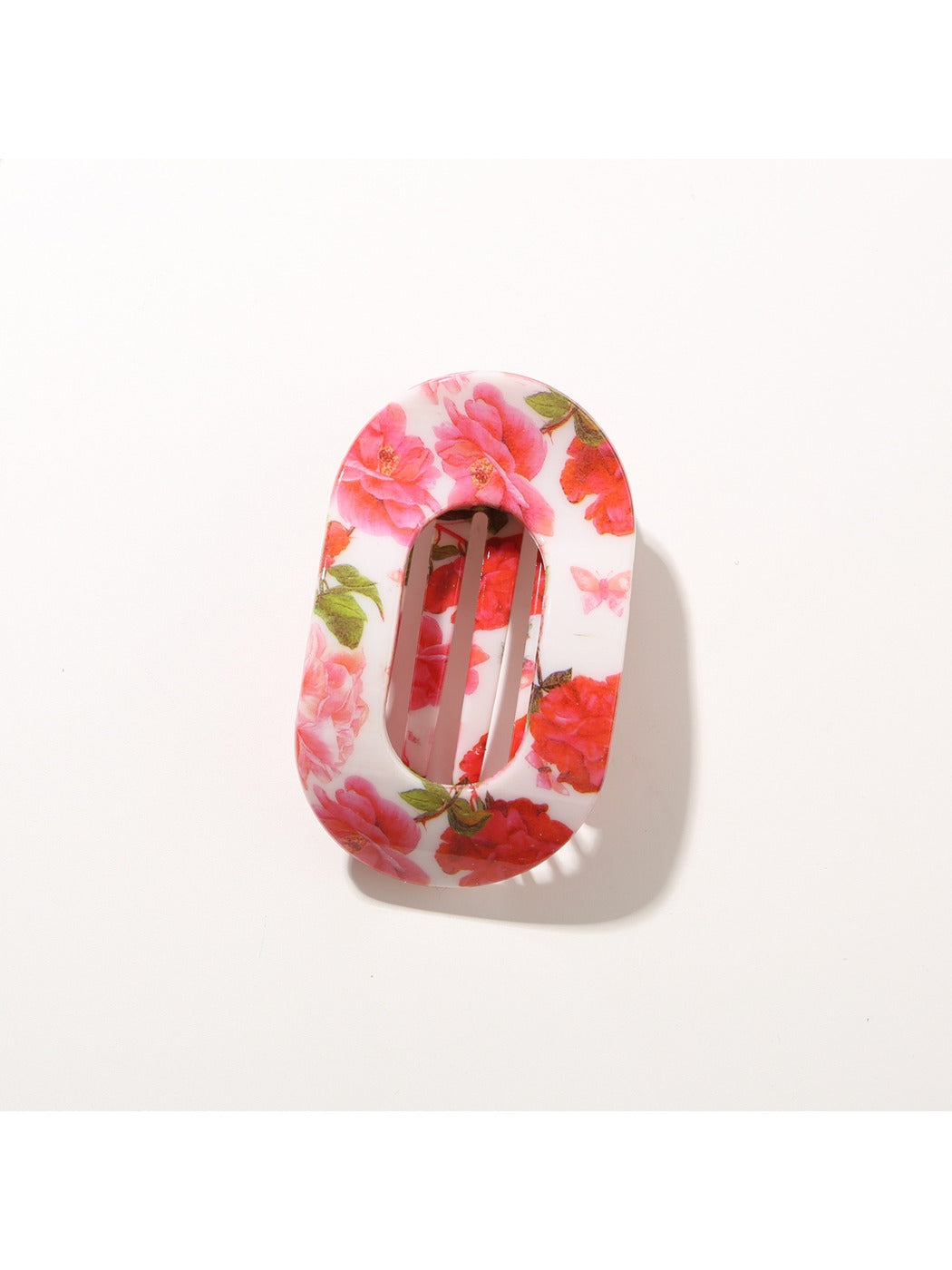 Beau hair clip photographed with natural light highlighting pattern details