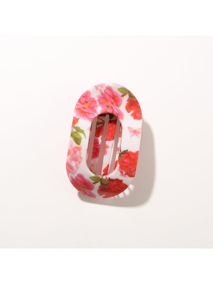 Beau hair clip photographed with natural light highlighting pattern details
