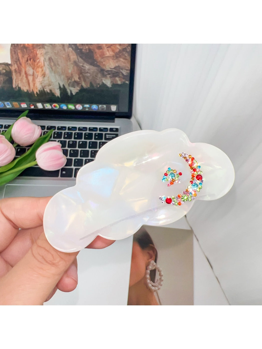 Beau cloud shaped hair claw clip shown with natural lighting emphasizing its glossy texture
