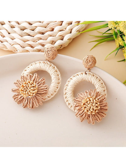 Earedge raffia daisy earrings shown from side angle highlighting thickness