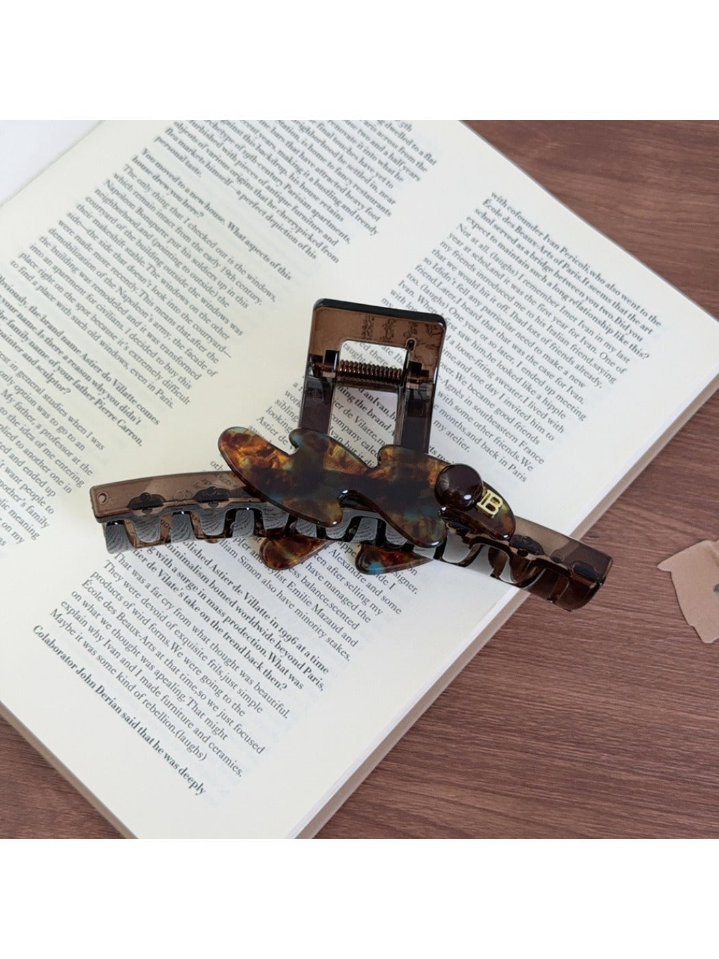 Beau large acetate claw clip displayed open showing inner teeth and clasp