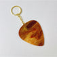 Keypus keychain with teardrop charm hanging from a backpack zipper pull