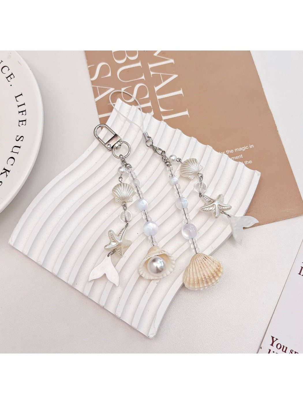 Pearlescent Keypus keychain charm hanging from a set of keys