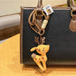 Close-up of the deer charm keychain's textured surface and polished finish