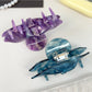 Beau hair claw clip open to display spring mechanism